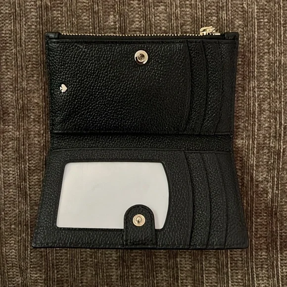Kate spade bi-fold Spencer Slim in black with gold tone hardware. - Picture 3 of 6
